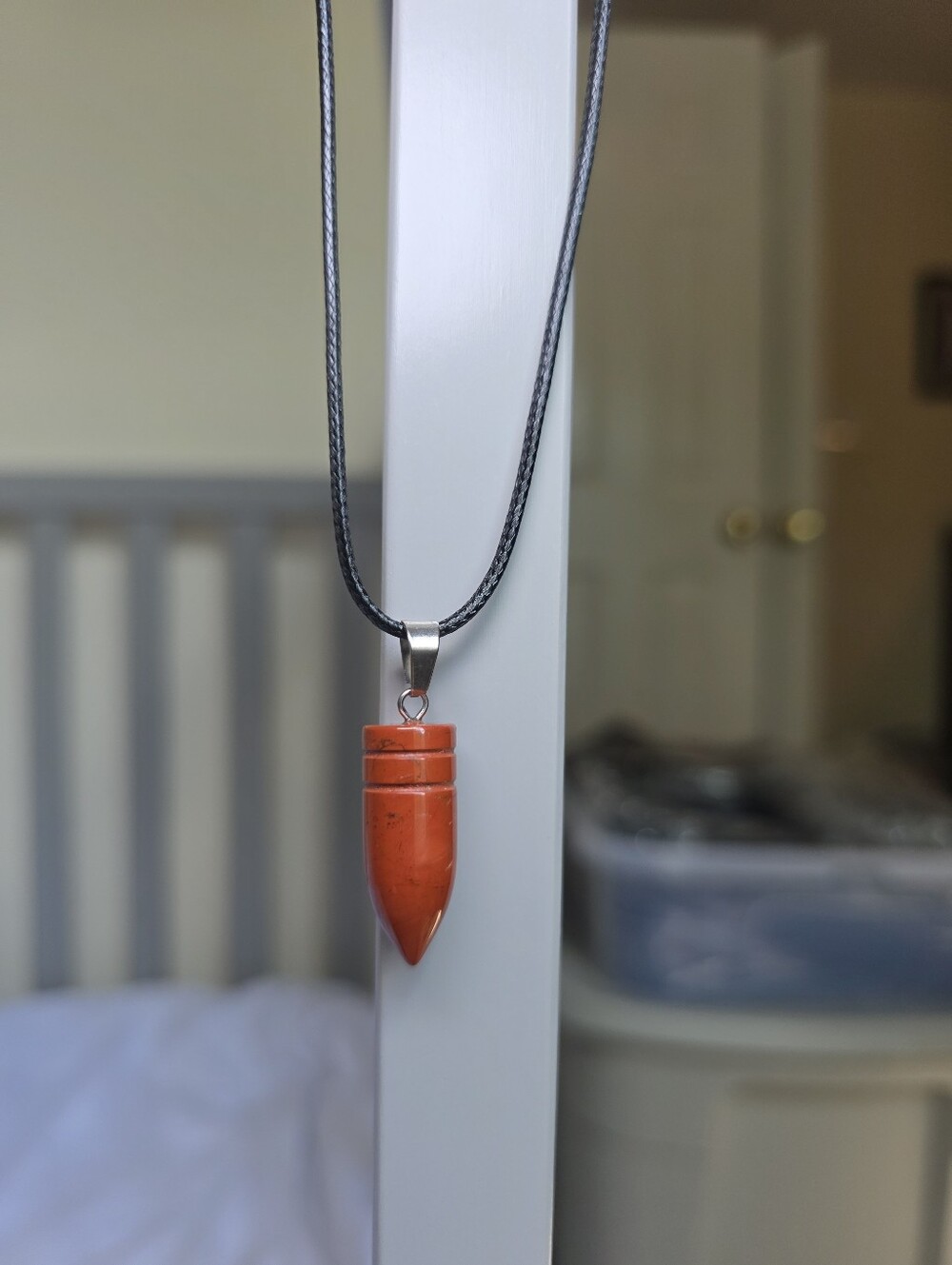 Orange Rust Stone Crystal Bullet Pendant On Black Cord Necklace